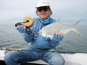 Sarasota winter resident, Gary Marple, with a nice pompano caught on an Ultra Hair Clouser fly while fishing Sarasota Bay with Capt. Rick Grassett.